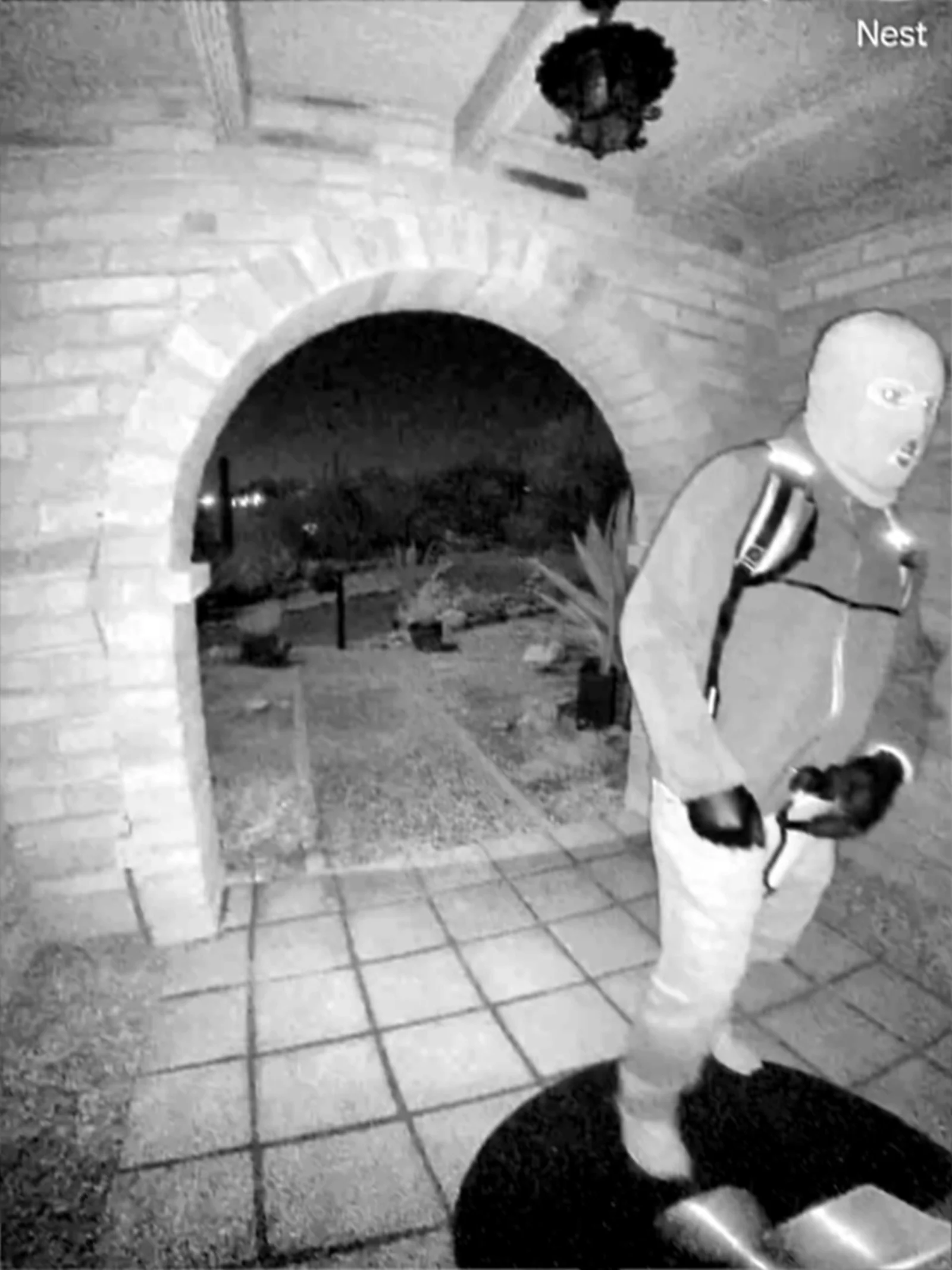 Suspect approaching Nancy's front door