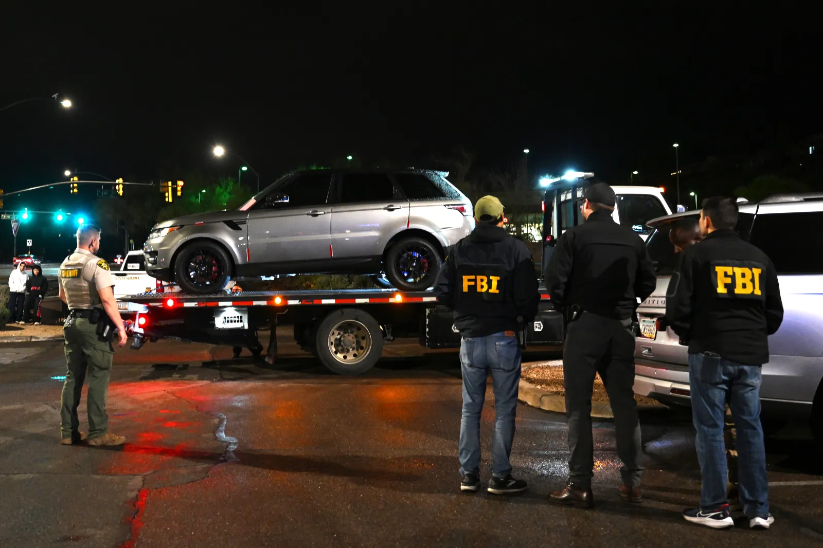 Gray/silver Range Rover searched and towed from the parking lot